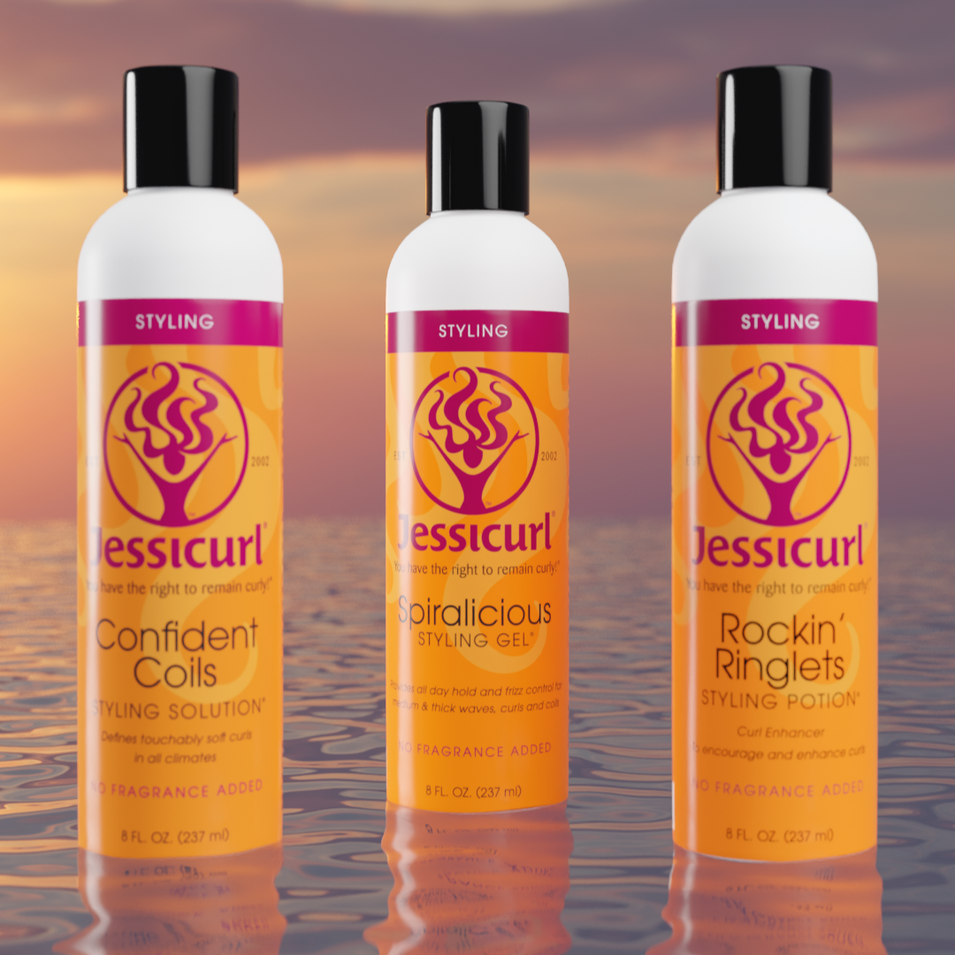 Jessicurl's Confident Coils, Spiralicious Styling Gel, and Rockin Ringlets sitting on top of water at sunsetJessicurl's Confident Coils, Spiralicious Styling Gel, and Rockin Ringlets sitting on top of water at sunset