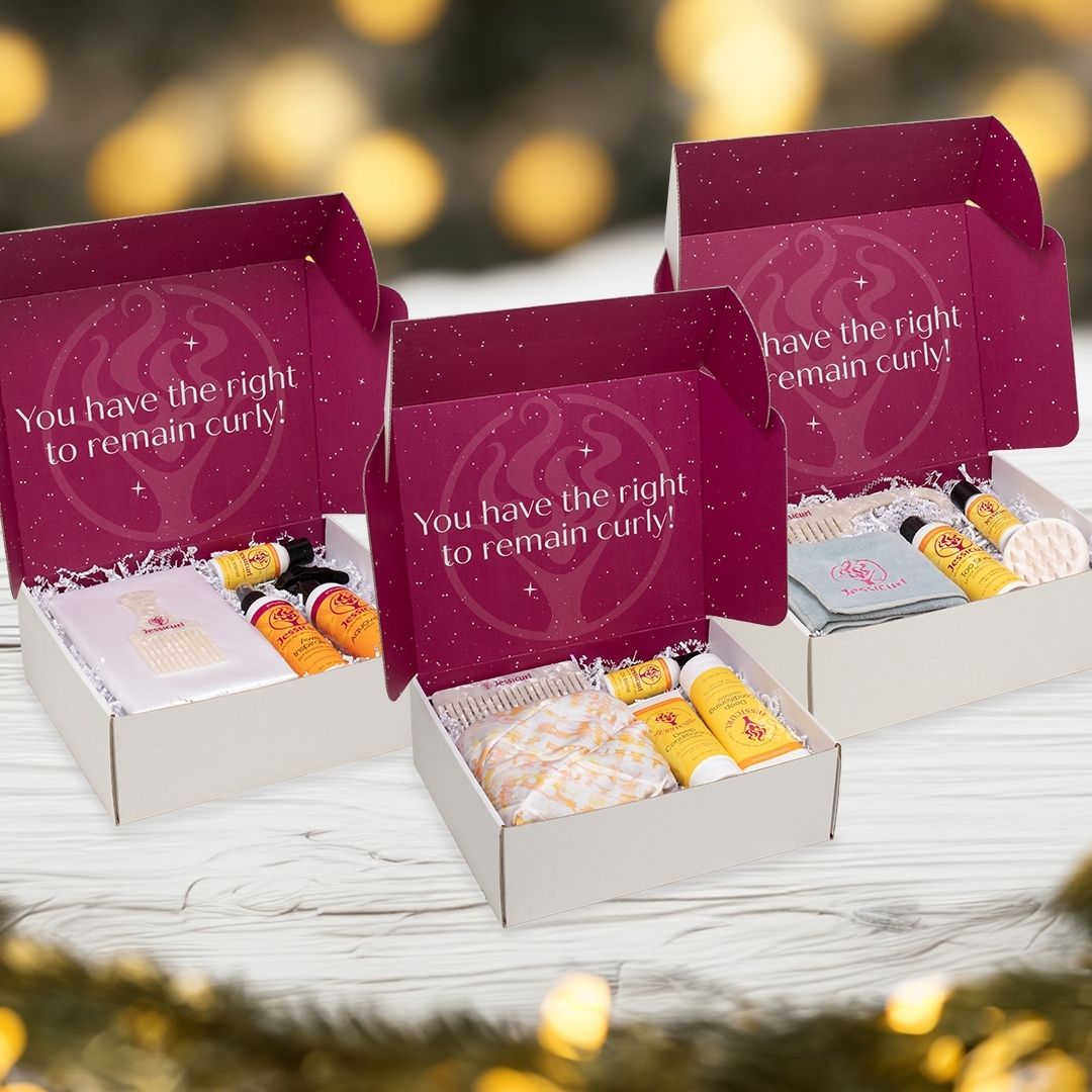 three limited edition Holiday Bundles in boxes from 2023 surrounded by snow and christmas trees