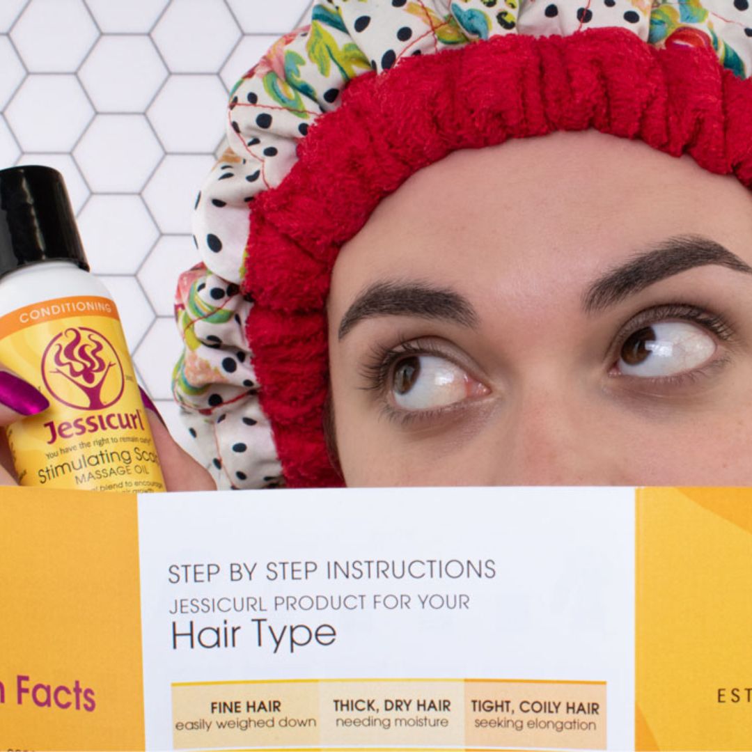 woman in heat cap holding a pamphlet over her face and a bottle of product