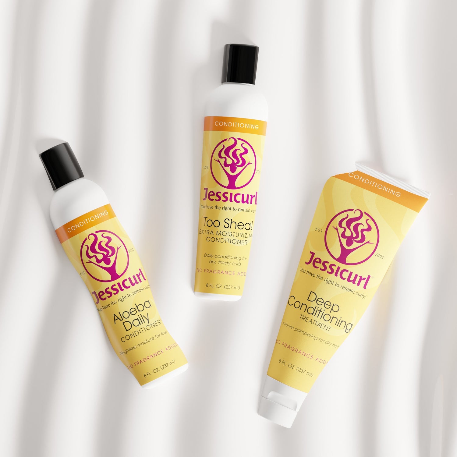 Jessicurl's line up of conditioners (Aloeba Daily Conditioner, Too Shea! Extra Moisturizing Conditioner, and Deep Conditioning Treatment) against a white background