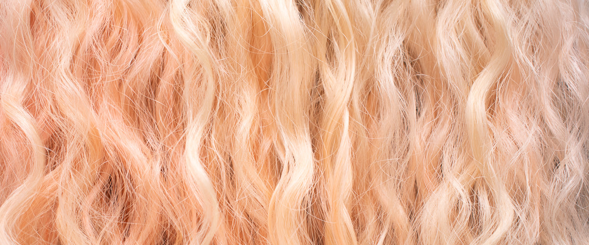 Shop Wavy Hair Products - Image of closed up of wavy blonde hair